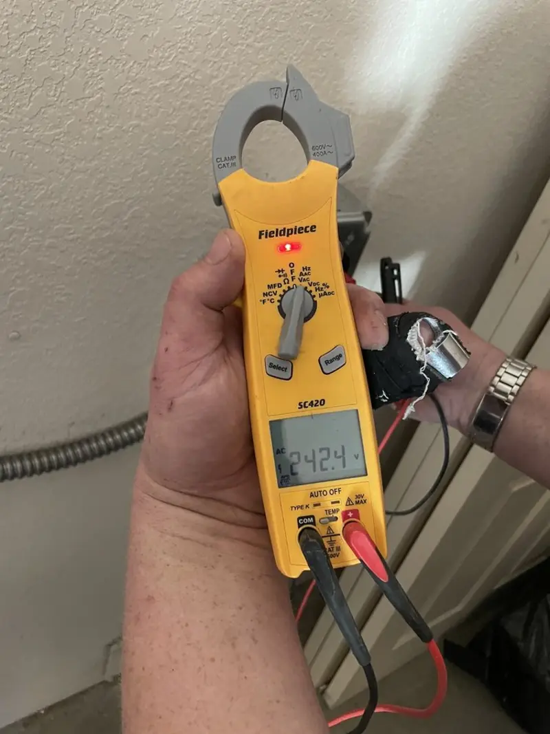 Voltage testing with clamp meter during Whole House Surge Protector in Central Gardens